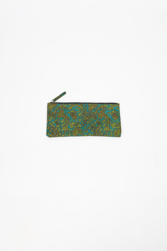 Eco-conscious quilted pencil pouch with waterproof lining made from upcycled garments, reflecting the values of circular fashion, carbon neutral fashion, and repurposed clothing. A perfect example of green fashion and sustainable women's clothing.