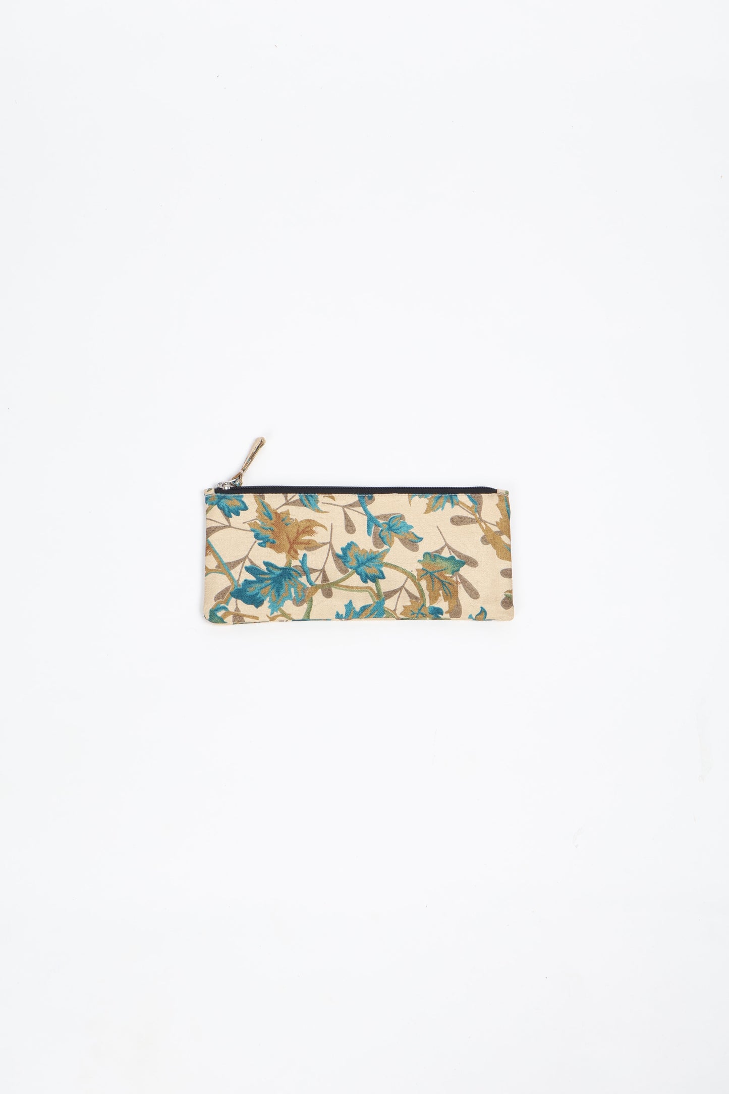 Eco-conscious quilted pencil pouch with waterproof lining made from upcycled garments, reflecting the values of circular fashion, carbon neutral fashion, and repurposed clothing. A perfect example of green fashion and sustainable women's clothing.
