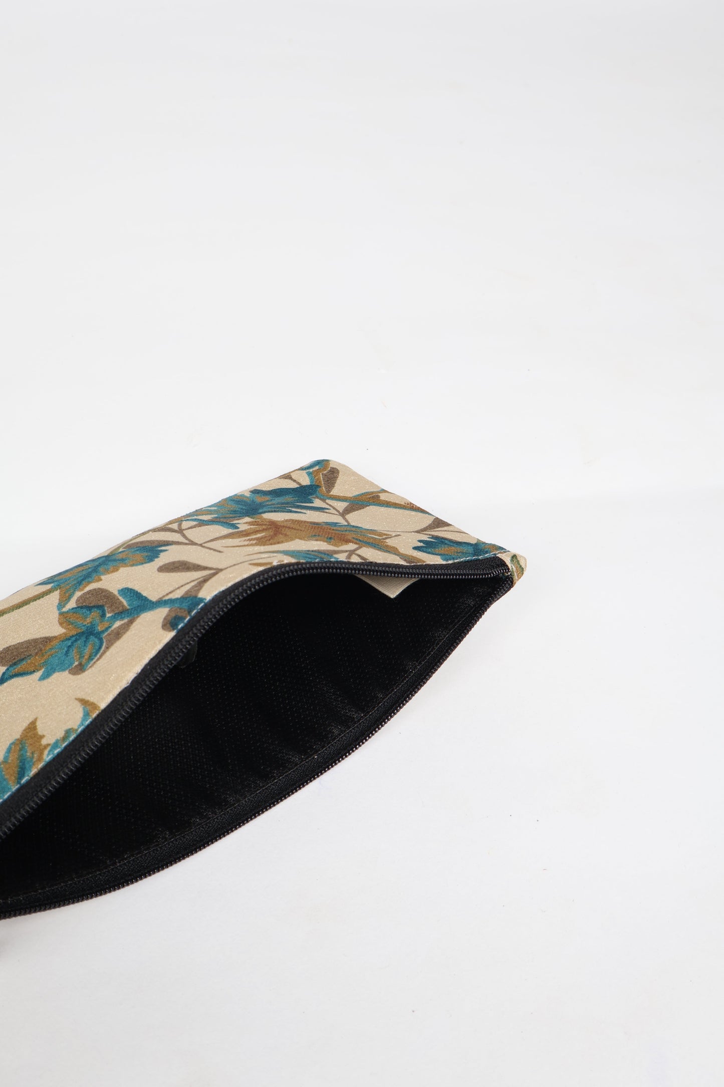 Eco-conscious quilted pencil pouch with waterproof lining made from upcycled garments, reflecting the values of circular fashion, carbon neutral fashion, and repurposed clothing. A perfect example of green fashion and sustainable women's clothing.