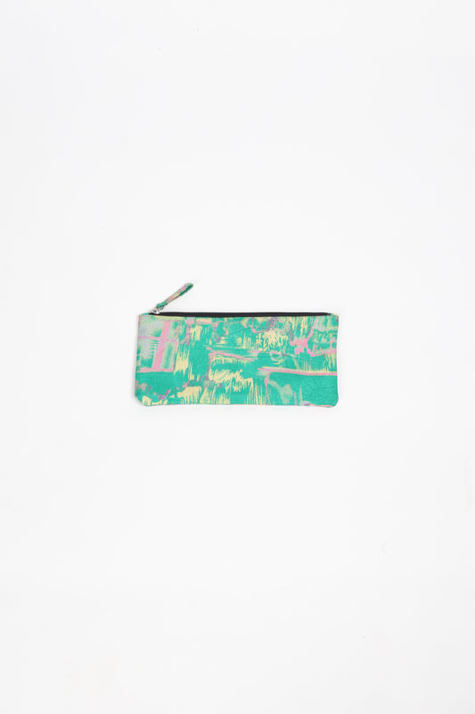 Eco-conscious quilted pencil pouch with waterproof lining made from upcycled garments, reflecting the values of circular fashion, carbon neutral fashion, and repurposed clothing. A perfect example of green fashion and sustainable women's clothing.