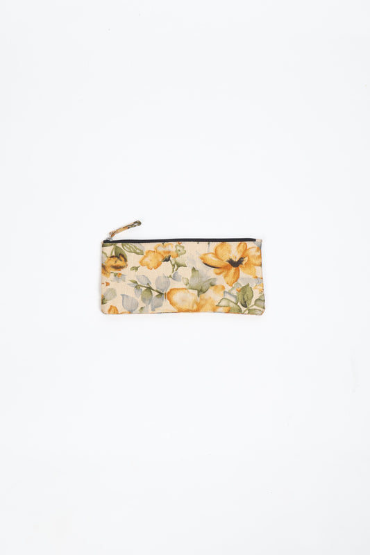 Eco-conscious quilted pencil pouch with waterproof lining made from upcycled garments, reflecting the values of circular fashion, carbon neutral fashion, and repurposed clothing. A perfect example of green fashion and sustainable women's clothing.