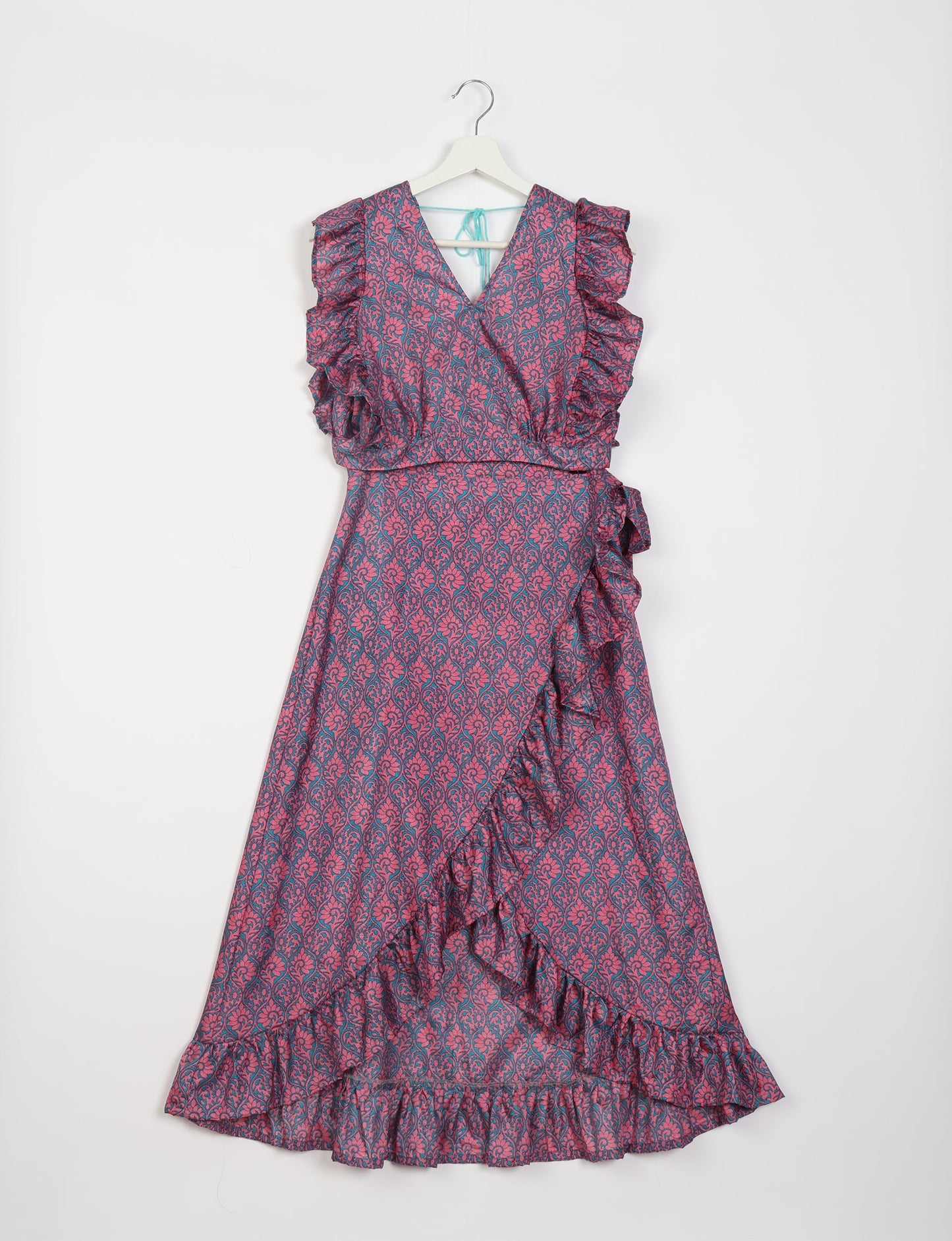 Frill Skirt Set made from recycled materials, highlighting sustainable fashion and fair trade practices. Features a ruffled wraparound skirt and a string-back top, symbolizing upcycled women's clothing and eco-friendly fashion.