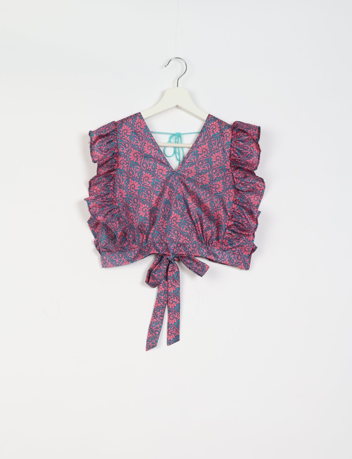 Frill Skirt Set made from recycled materials, highlighting sustainable fashion and fair trade practices. Features a ruffled wraparound skirt and a string-back top, symbolizing upcycled women's clothing and eco-friendly fashion.