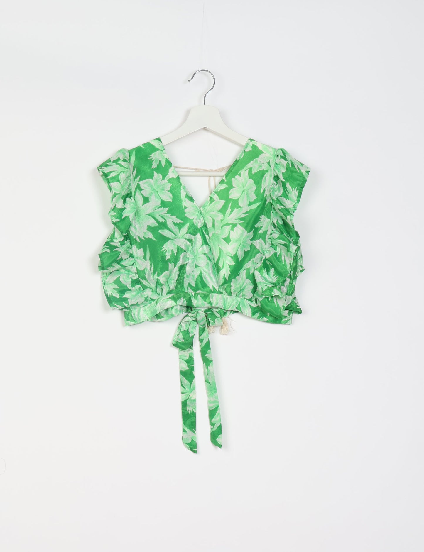 Frill Skirt Set made from recycled materials, highlighting sustainable fashion and fair trade practices. Features a ruffled wraparound skirt and a string-back top, symbolizing upcycled women's clothing and eco-friendly fashion.