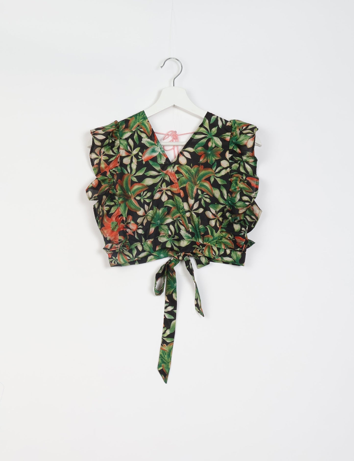 Frill Skirt Set made from recycled materials, highlighting sustainable fashion and fair trade practices. Features a ruffled wraparound skirt and a string-back top, symbolizing upcycled women's clothing and eco-friendly fashion.