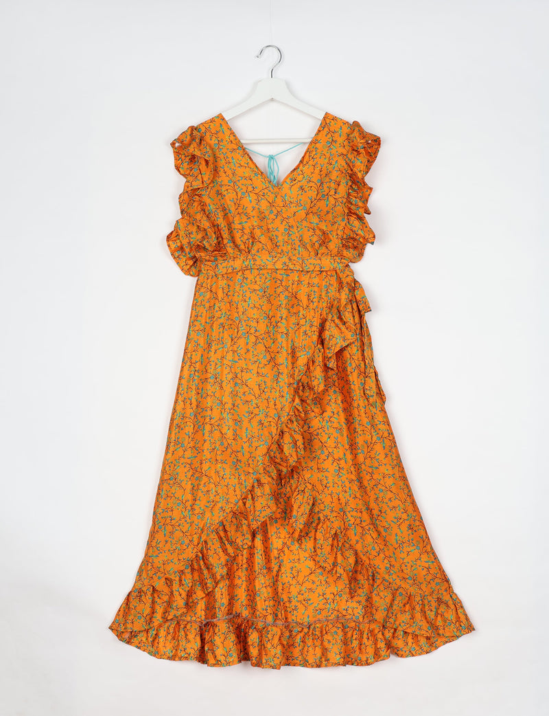 Yellow tropical floral frill skirt set with ruffled sleeves and hem, V-neck, and tie detail on back, hanging on white hanger