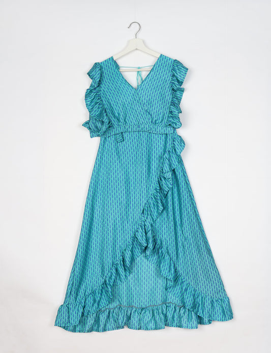 Frill Skirt Set made from recycled materials, highlighting sustainable fashion and fair trade practices. Features a ruffled wraparound skirt and a string-back top, symbolizing upcycled women's clothing and eco-friendly fashion.