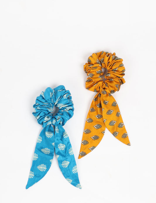 Colorful Tail Scrunchy made from sustainable, upcycled women's clothing. An eco-friendly fashion accessory promoting green fashion, recycled clothing, and ethical fashion choices.