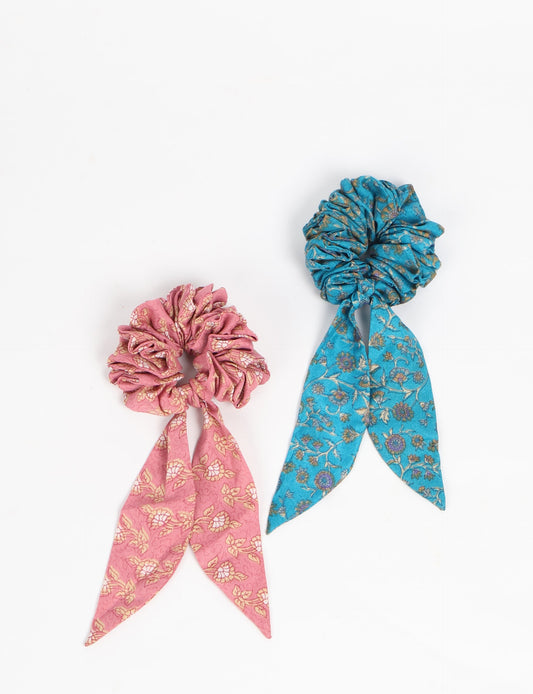 Colorful Tail Scrunchy made from sustainable, upcycled women's clothing. An eco-friendly fashion accessory promoting green fashion, recycled clothing, and ethical fashion choices.