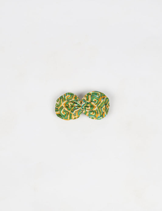 Stylish upcycled women's hairclip made from eco friendly products, reflecting the essence of upcycling fashion, ethical clothing, and sustainable apparel—ideal for those embracing slow fashion and earth friendly clothing.