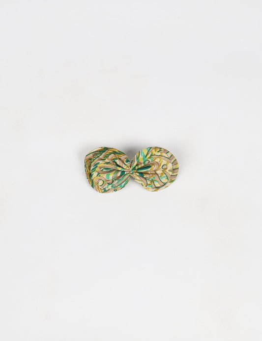 Stylish upcycled women's hairclip made from eco friendly products, reflecting the essence of upcycling fashion, ethical clothing, and sustainable apparel—ideal for those embracing slow fashion and earth friendly clothing.