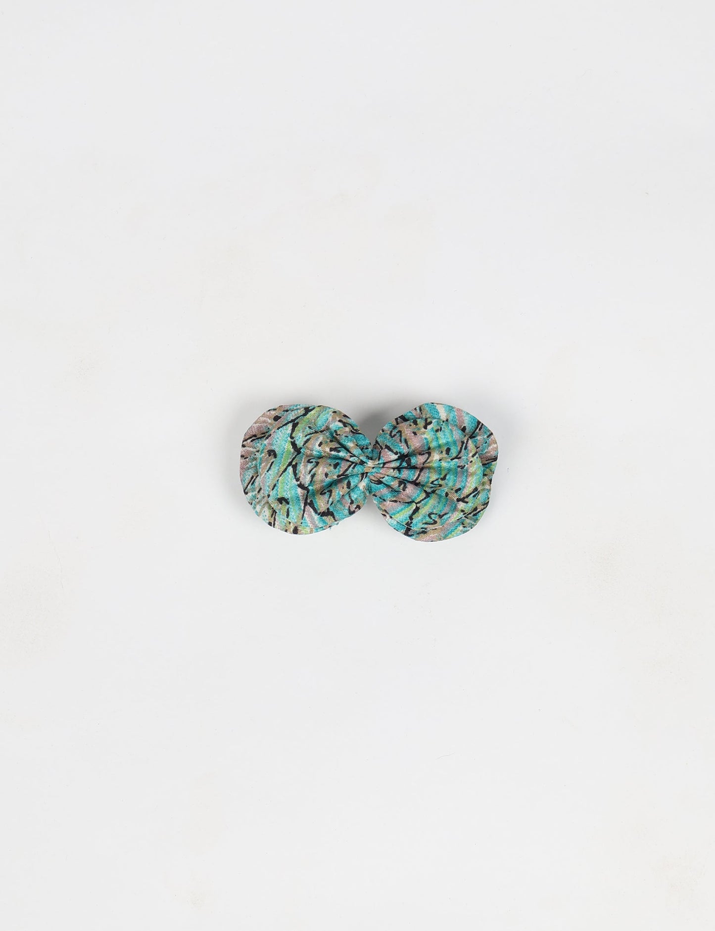 Stylish upcycled women's hairclip made from eco friendly products, reflecting the essence of upcycling fashion, ethical clothing, and sustainable apparel—ideal for those embracing slow fashion and earth friendly clothing.