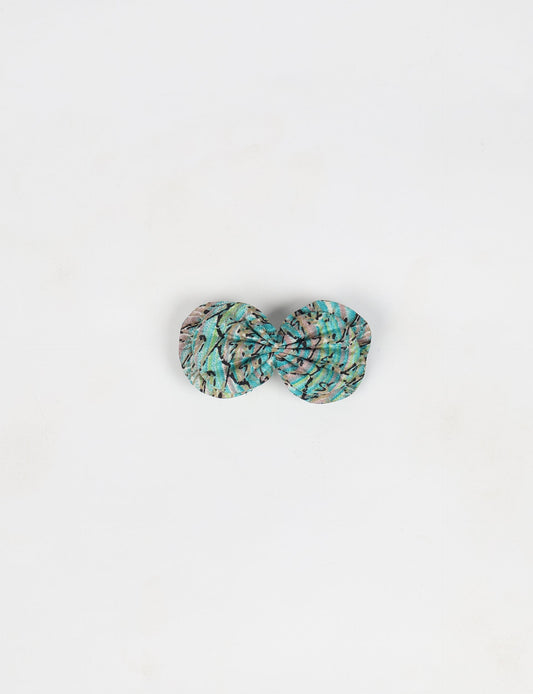 Stylish upcycled women's hairclip made from eco friendly products, reflecting the essence of upcycling fashion, ethical clothing, and sustainable apparel—ideal for those embracing slow fashion and earth friendly clothing.