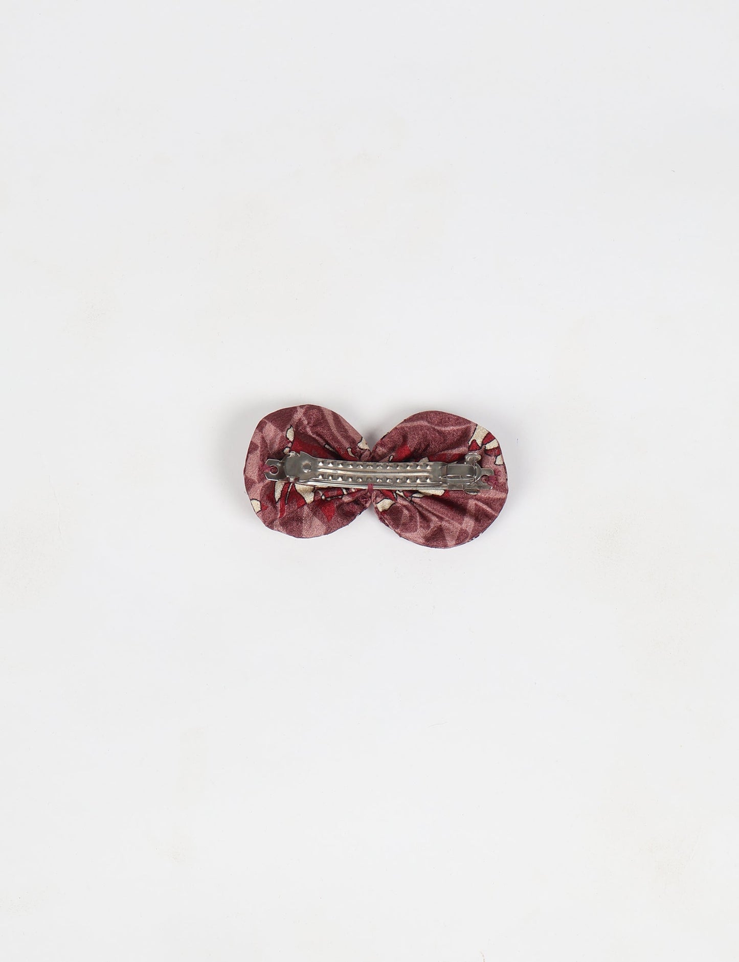 Stylish upcycled women's hairclip made from eco friendly products, reflecting the essence of upcycling fashion, ethical clothing, and sustainable apparel—ideal for those embracing slow fashion and earth friendly clothing.