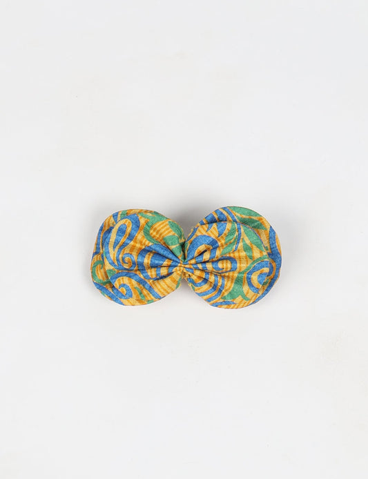 Stylish upcycled women's hairclip made from eco friendly products, reflecting the essence of upcycling fashion, ethical clothing, and sustainable apparel—ideal for those embracing slow fashion and earth friendly clothing.