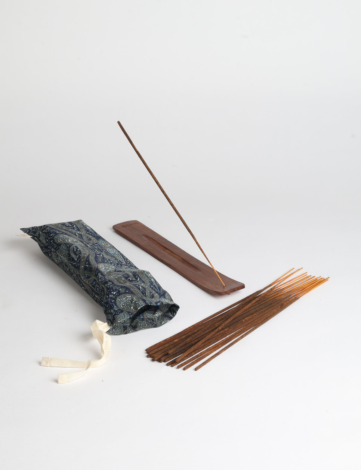 Incense stick set with wooden holder and repurposed sari fabric pouch, including 40 incense sticks.