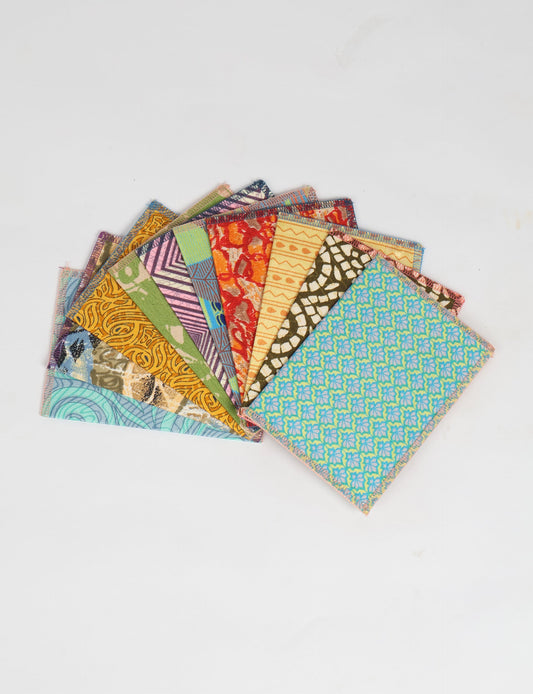 Sustainably crafted FOLDED POSTCARD SET, 10 assorted pieces made with 100% recycled paper and printed sari fabric sourced from Mumbai markets. Eco-friendly with contrast overlock edging. Envelopes included for eco-conscious gratitude and cheerful messages to loved ones.