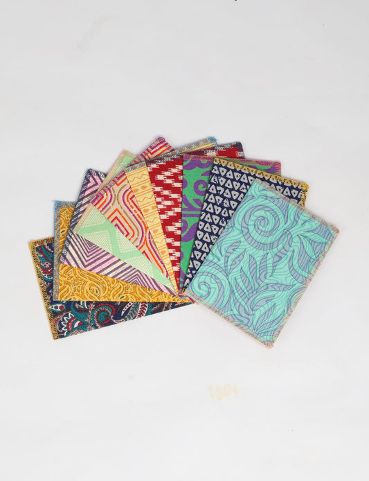 Sustainably crafted FOLDED POSTCARD SET, 10 assorted pieces made with 100% recycled paper and printed sari fabric sourced from Mumbai markets. Eco-friendly with contrast overlock edging. Envelopes included for eco-conscious gratitude and cheerful messages to loved ones.