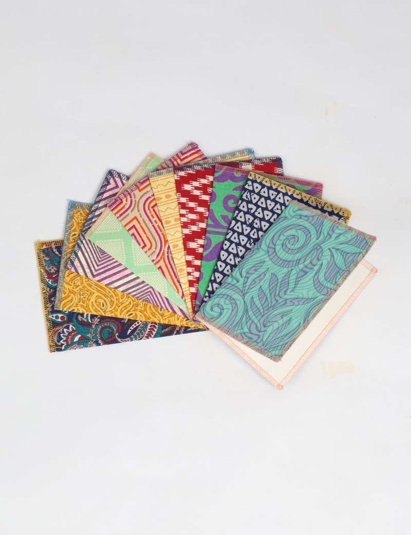 Folded postcard set of 10 pieces with colorful, patterned fabric covers, shown fanned out on a white background