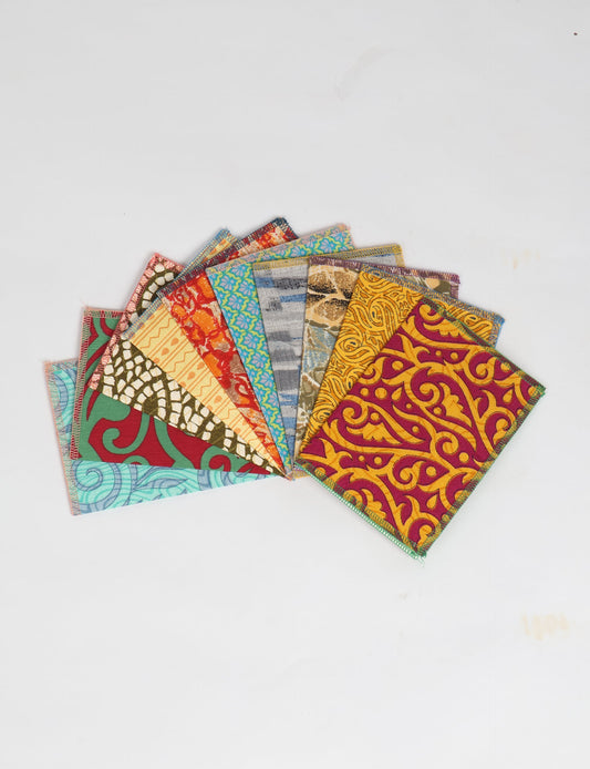 Sustainably crafted FOLDED POSTCARD SET, 10 assorted pieces made with 100% recycled paper and printed sari fabric sourced from Mumbai markets. Eco-friendly with contrast overlock edging. Envelopes included for eco-conscious gratitude and cheerful messages to loved ones.