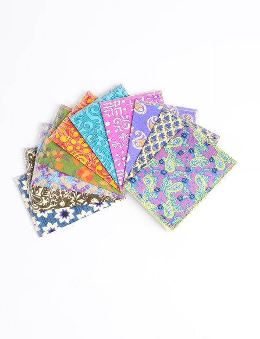 Sustainably crafted FOLDED POSTCARD SET, 10 assorted pieces made with 100% recycled paper and printed sari fabric sourced from Mumbai markets. Eco-friendly with contrast overlock edging. Envelopes included for eco-conscious gratitude and cheerful messages to loved ones.