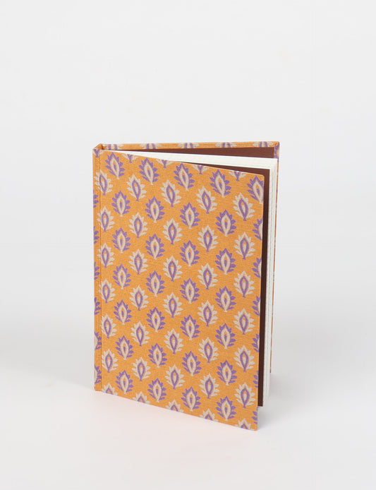 Elevate your scribbling experience with our A5 hardcover notebook, an epitome of green fashion. Sustainable and upcycled, this notebook features recycled fabric covers and aligns with the ethos of circular fashion. Dive into conscious living with our eco-friendly, recycled material notebook.