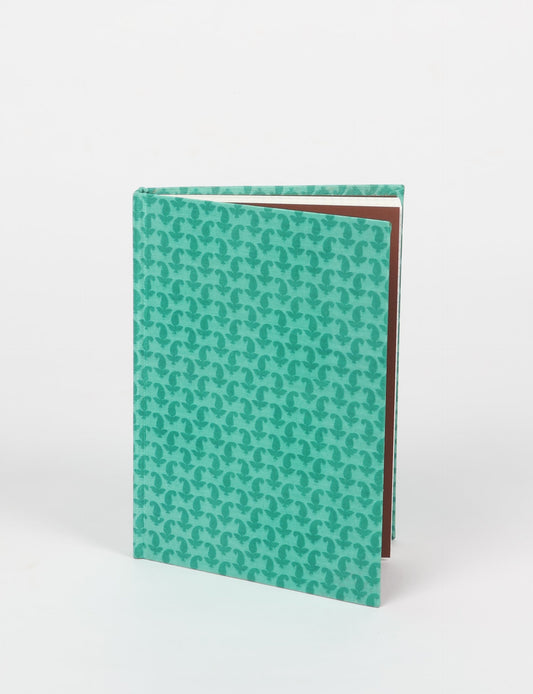 Elevate your scribbling experience with our A5 hardcover notebook, an epitome of green fashion. Sustainable and upcycled, this notebook features recycled fabric covers and aligns with the ethos of circular fashion. Dive into conscious living with our eco-friendly, recycled material notebook.