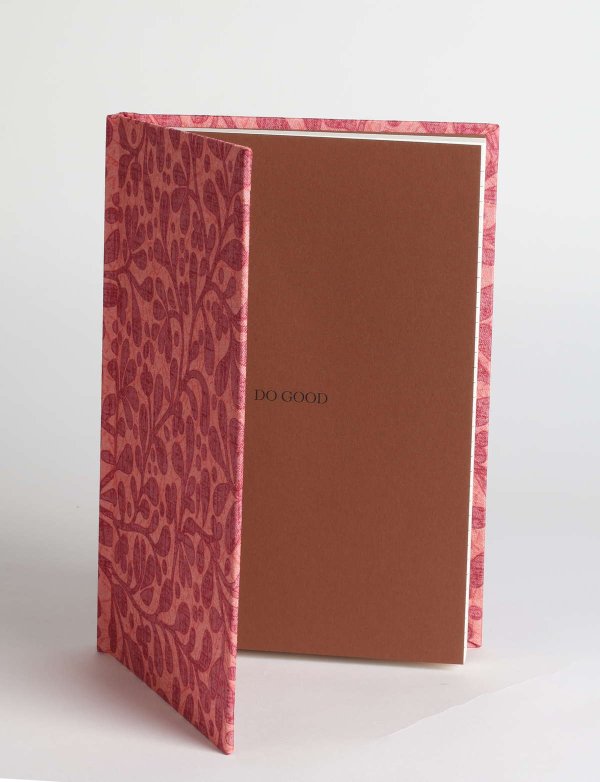A5 hard cover notebook featuring the DO GOOD message, durable hardbound cover, ruled inner pages, printed endpapers and a lay-flat design.