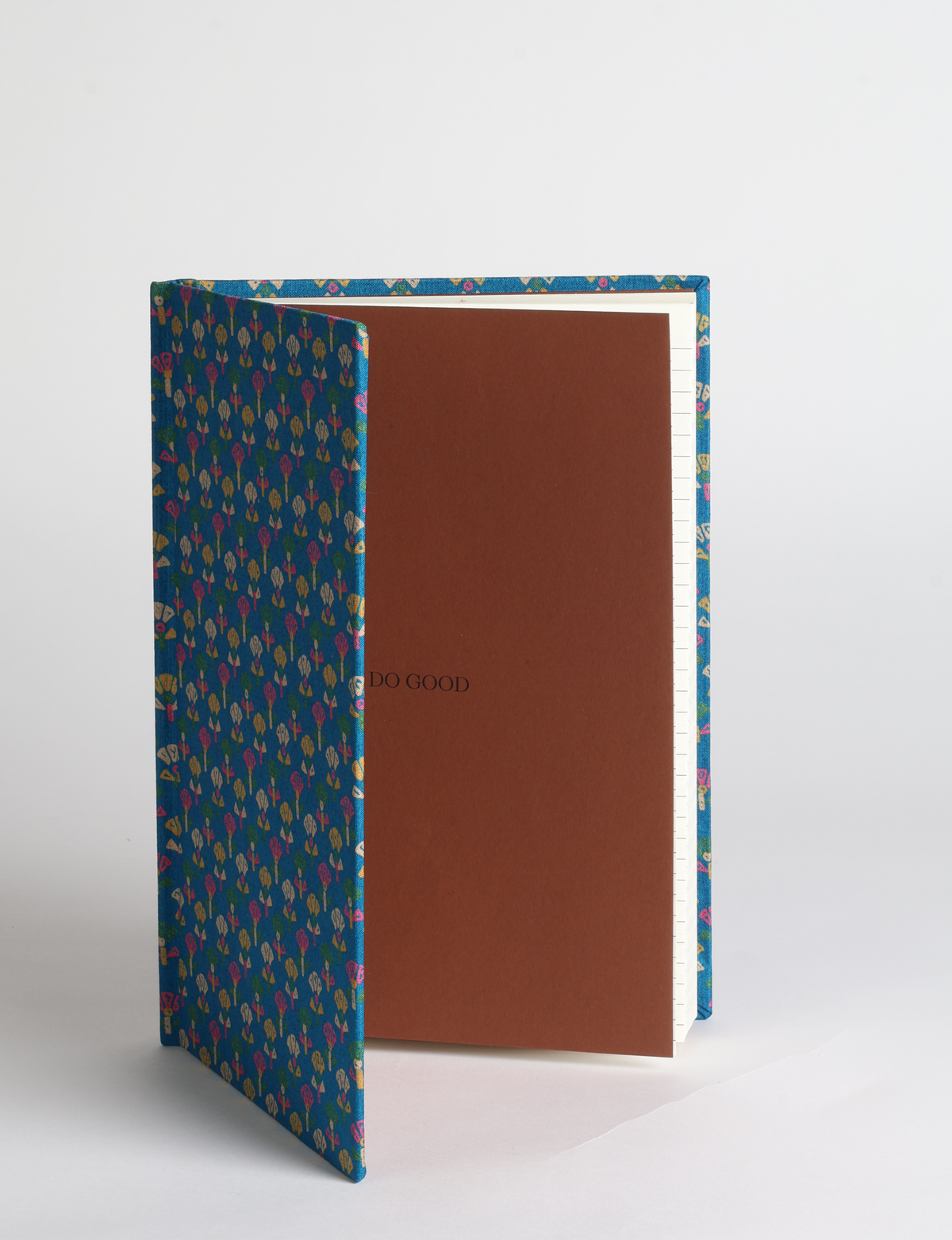 A5 hard cover notebook featuring the DO GOOD message, durable hardbound cover, ruled inner pages, printed endpapers and a lay-flat design.