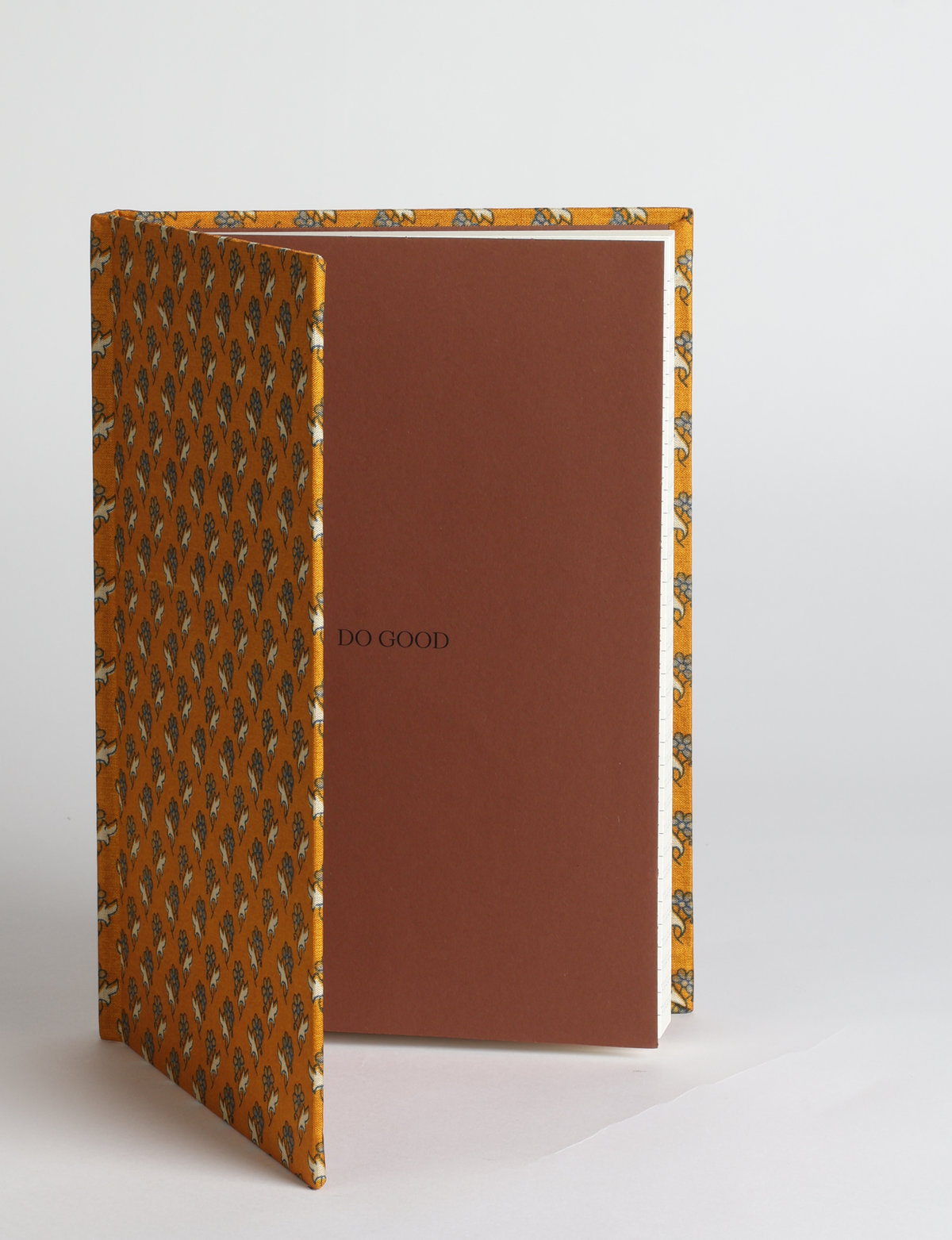 A5 hard cover notebook featuring the DO GOOD message, durable hardbound cover, ruled inner pages, printed endpapers and a lay-flat design.