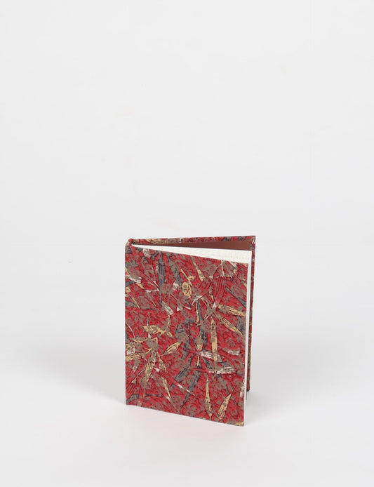 Indulge your creative spirit with our A6 hardcover notebook – a blend of sustainability and style. Made with 100% recycled paper and adorned with pre-loved sari fabric, this eco-conscious notebook encourages mindful note-taking and resonates with the principles of eco-friendly fashion.