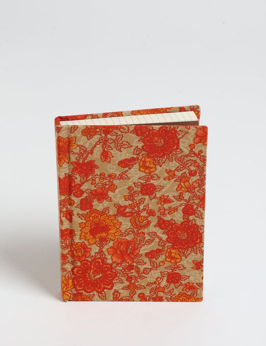 Indulge your creative spirit with our A6 hardcover notebook – a blend of sustainability and style. Made with 100% recycled paper and adorned with pre-loved sari fabric, this eco-conscious notebook encourages mindful note-taking and resonates with the principles of eco-friendly fashion.