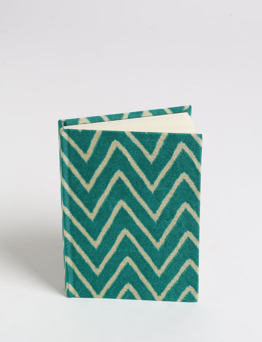 Indulge your creative spirit with our A6 hardcover notebook – a blend of sustainability and style. Made with 100% recycled paper and adorned with pre-loved sari fabric, this eco-conscious notebook encourages mindful note-taking and resonates with the principles of eco-friendly fashion.