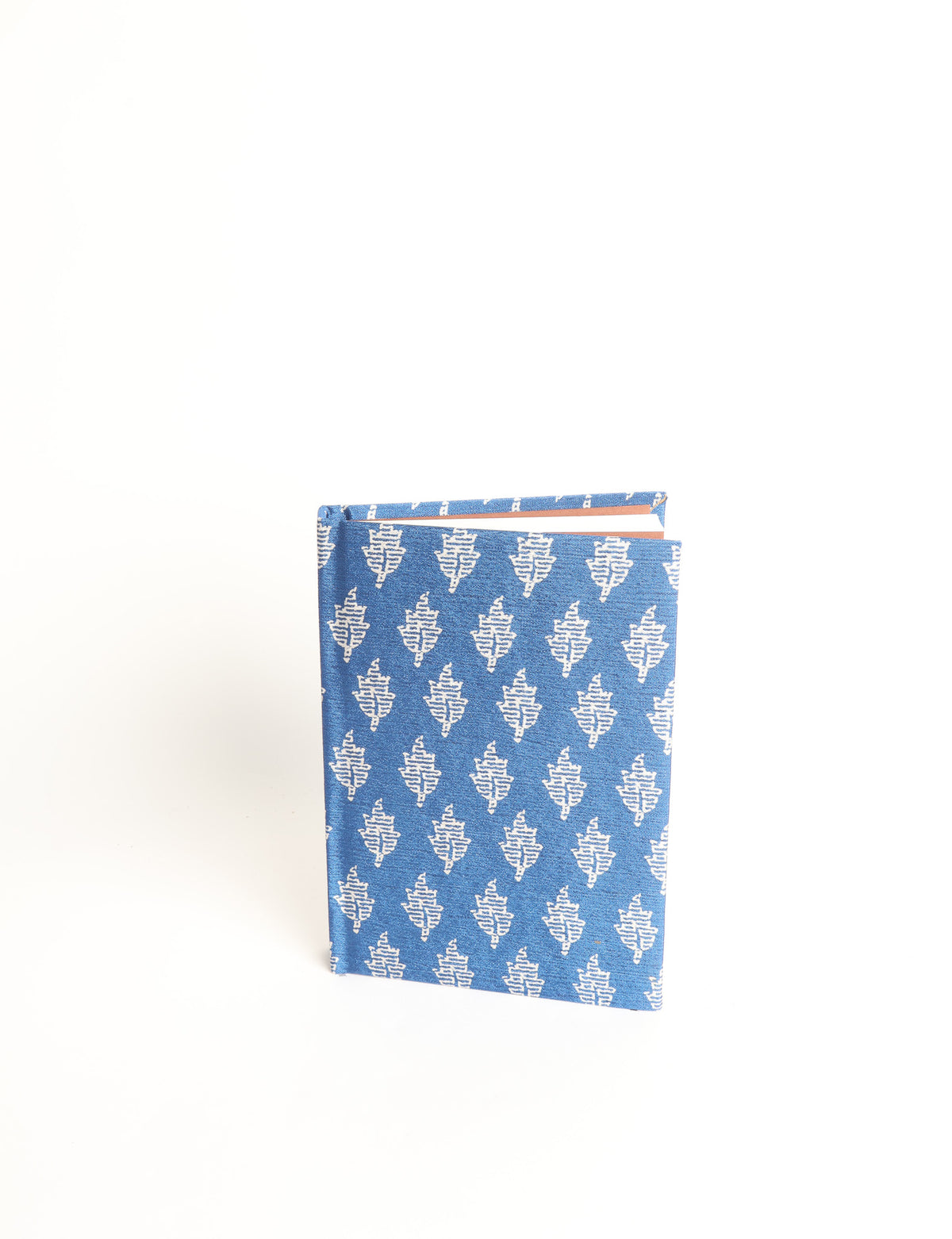 A6 hard cover notebook with teal pre-loved sari fabric cover featuring dark green floral vine pattern, standing upright