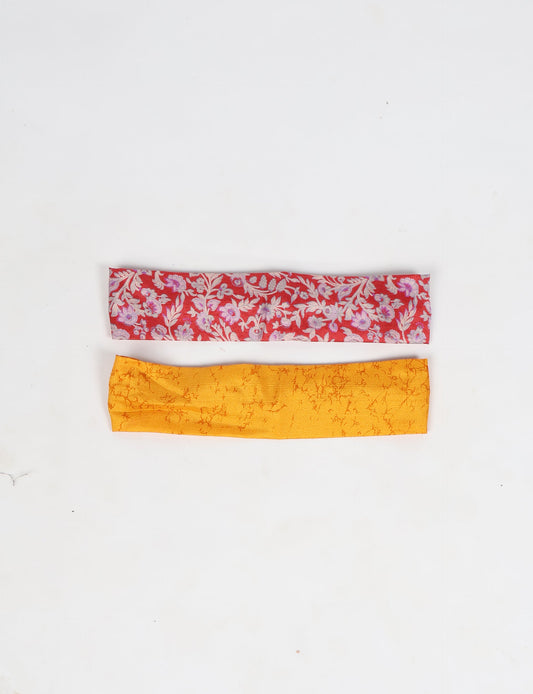 Upcycled sari elastic headband in colorful recycled fabric, handmade with zero waste clothing practices—an example of ethical clothing, fair trade fashion, and eco friendly fashion supporting climate neutral, sustainable women’s clothing.
