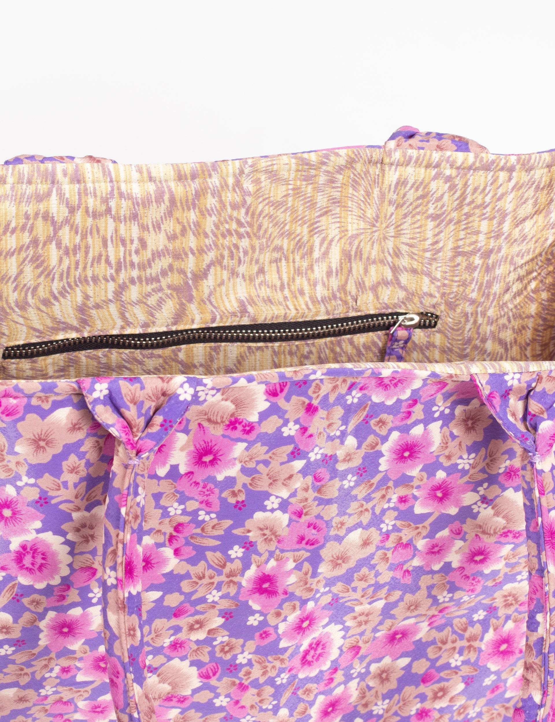 Purple floral fabric work tote bag interior with beige and purple patterned lining and black zipper pocket
