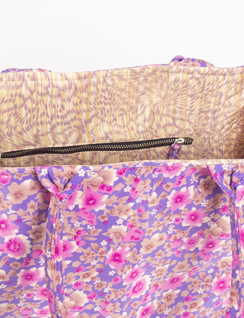 Purple floral fabric work tote bag interior with beige and purple patterned lining and black zipper pocket