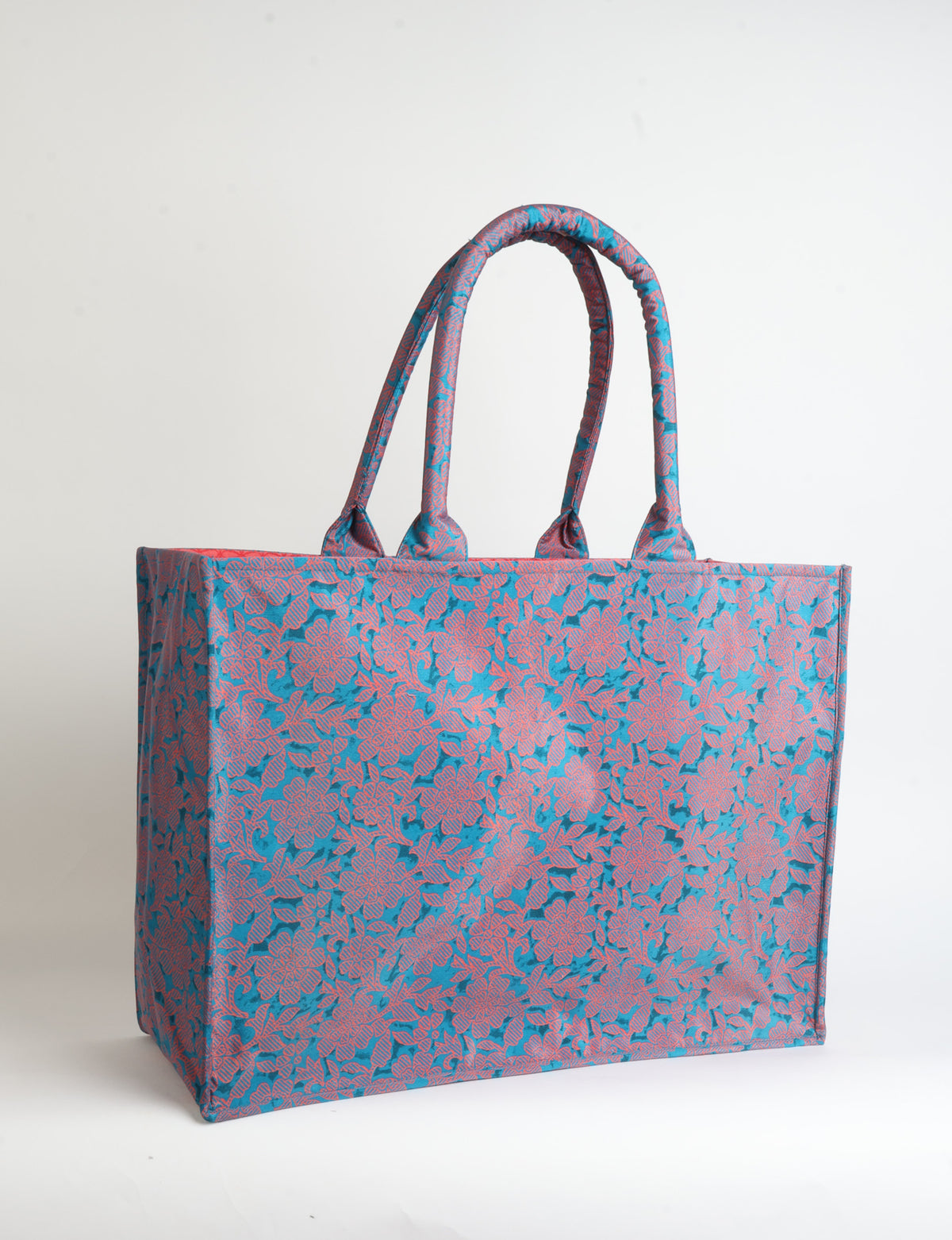 Grey floral patterned work tote bag with padded handles, front view, standing upright on white background