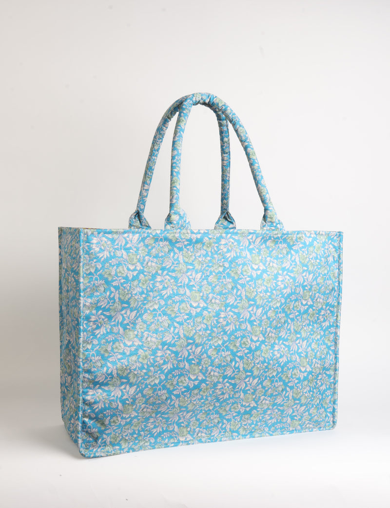 Grey floral patterned work tote bag with padded handles, front view, standing upright on white background