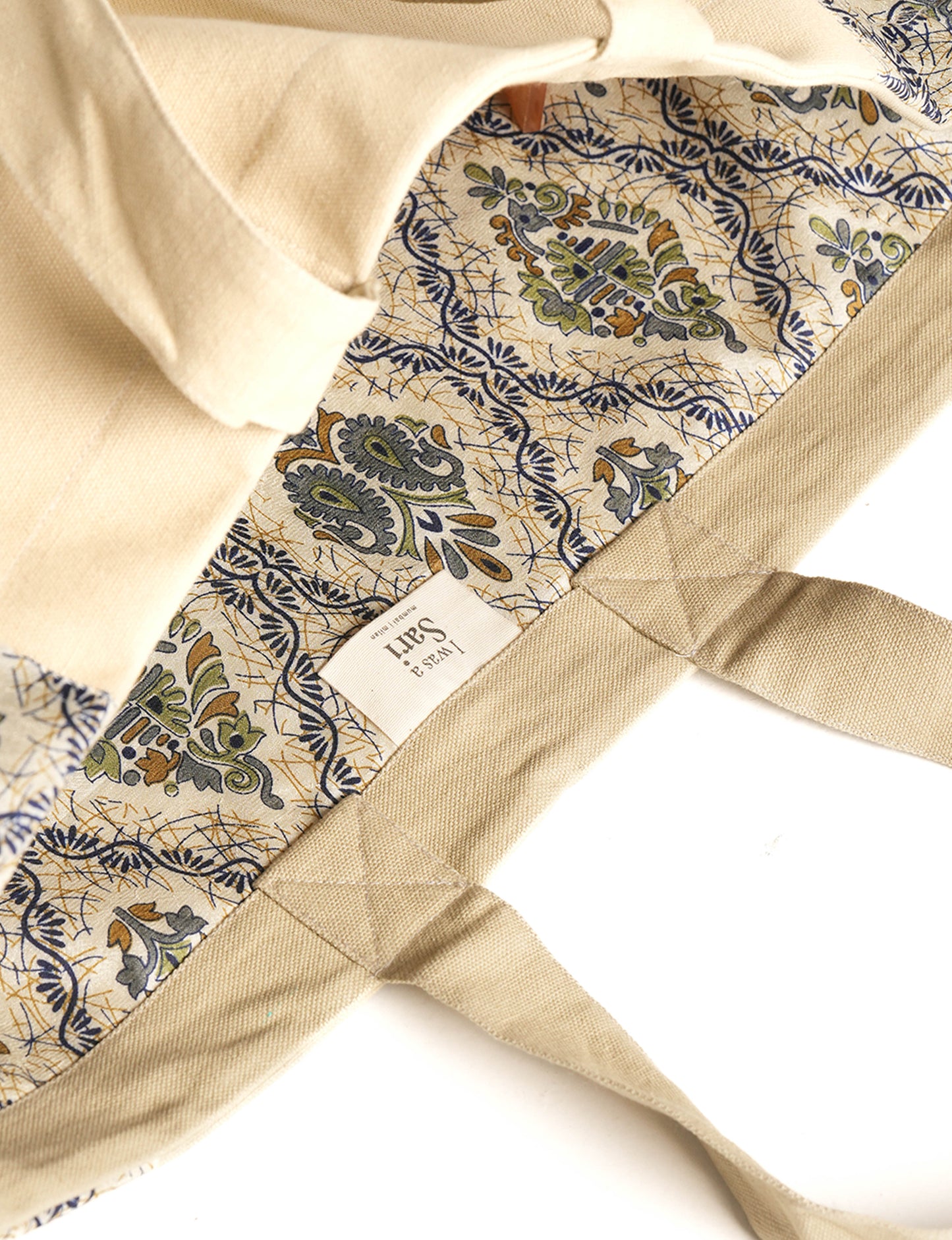 Lighten your eco-load with our FRINGE CARRY-ALL BAG. Soft canvas with a patchwork design, inside lining made of vibrant sari fabric, and beautifully soft sari-fringed edging. Crafted with 100% cotton canvas for a sustainable and stylish carry-all.