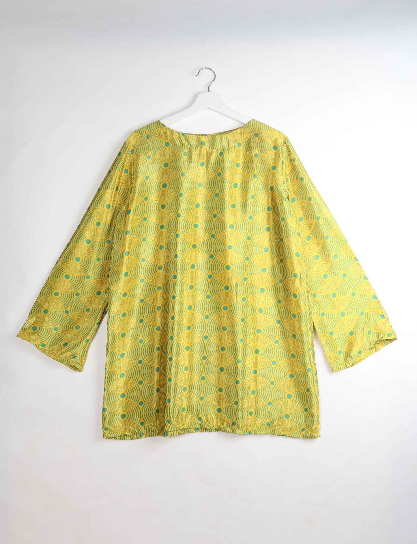 Chic and conscious, our A-line mini swing dress is a must-have in sustainable fashion. Adorned with flared sleeves, a keyhole back opening, and a mother of pearl button with twill tape loop. This zero waste, upcycled garment reflects the essence of eco-friendly and ethical clothing.