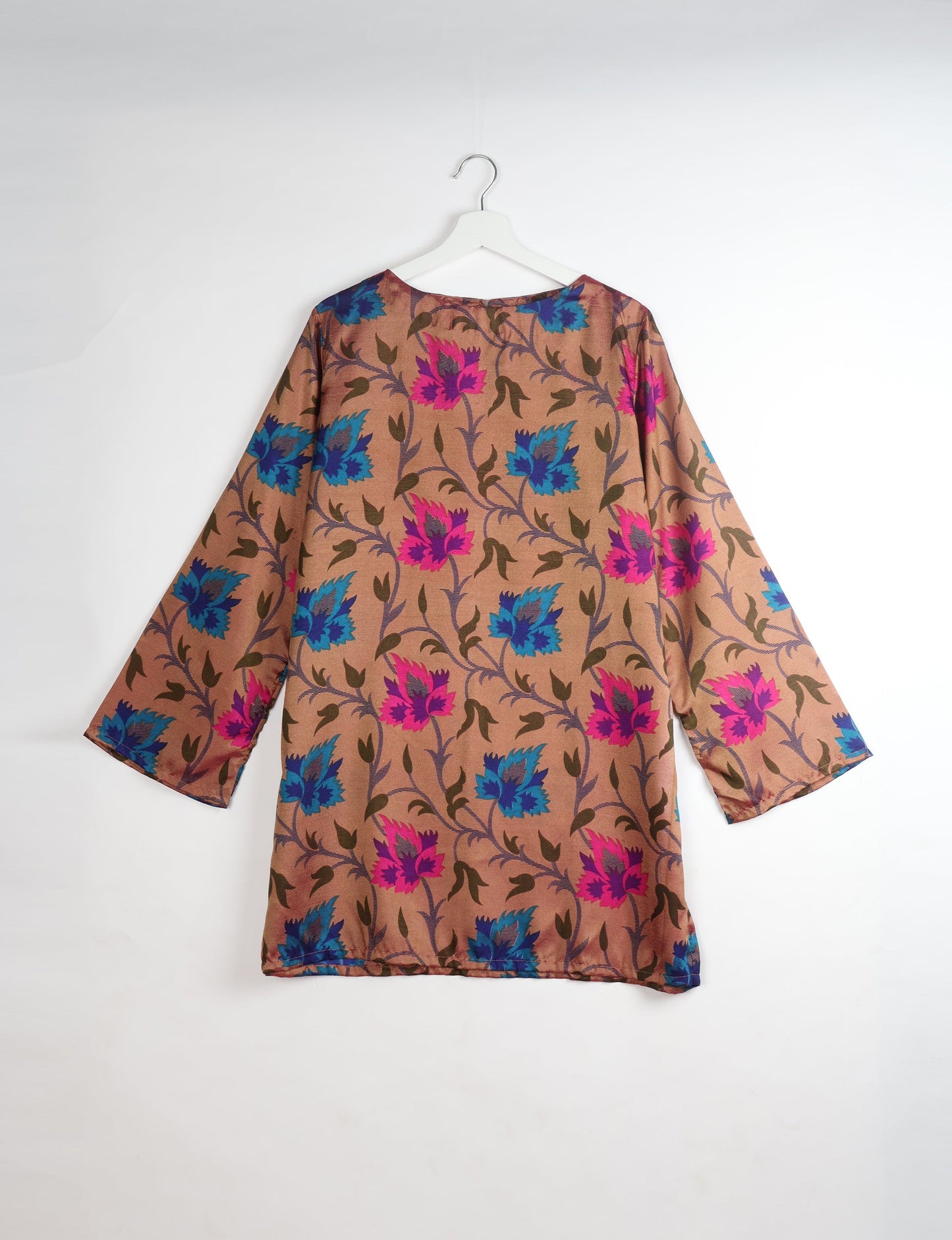 Chic and conscious, our A-line mini swing dress is a must-have in sustainable fashion. Adorned with flared sleeves, a keyhole back opening, and a mother of pearl button with twill tape loop. This zero waste, upcycled garment reflects the essence of eco-friendly and ethical clothing.