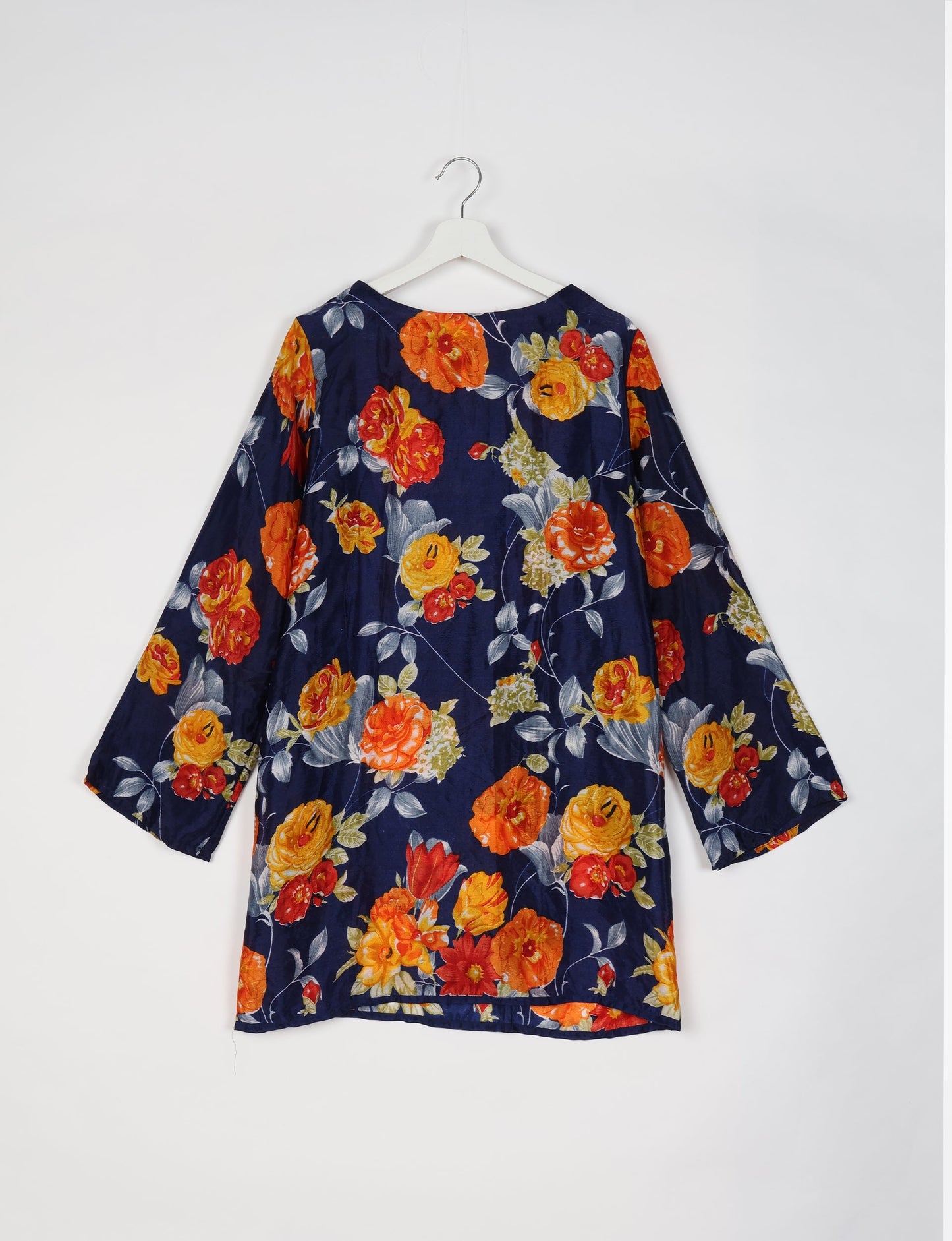 Chic and conscious, our A-line mini swing dress is a must-have in sustainable fashion. Adorned with flared sleeves, a keyhole back opening, and a mother of pearl button with twill tape loop. This zero waste, upcycled garment reflects the essence of eco-friendly and ethical clothing.