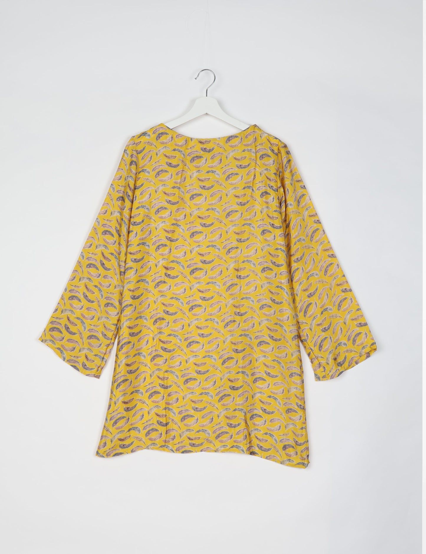 Chic and conscious, our A-line mini swing dress is a must-have in sustainable fashion. Adorned with flared sleeves, a keyhole back opening, and a mother of pearl button with twill tape loop. This zero waste, upcycled garment reflects the essence of eco-friendly and ethical clothing.