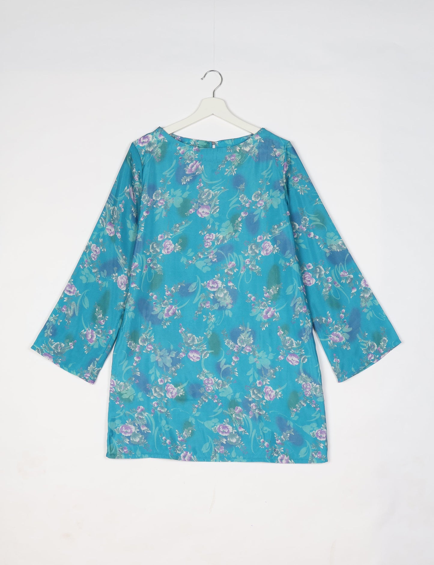 Chic and conscious, our A-line mini swing dress is a must-have in sustainable fashion. Adorned with flared sleeves, a keyhole back opening, and a mother of pearl button with twill tape loop. This zero waste, upcycled garment reflects the essence of eco-friendly and ethical clothing.