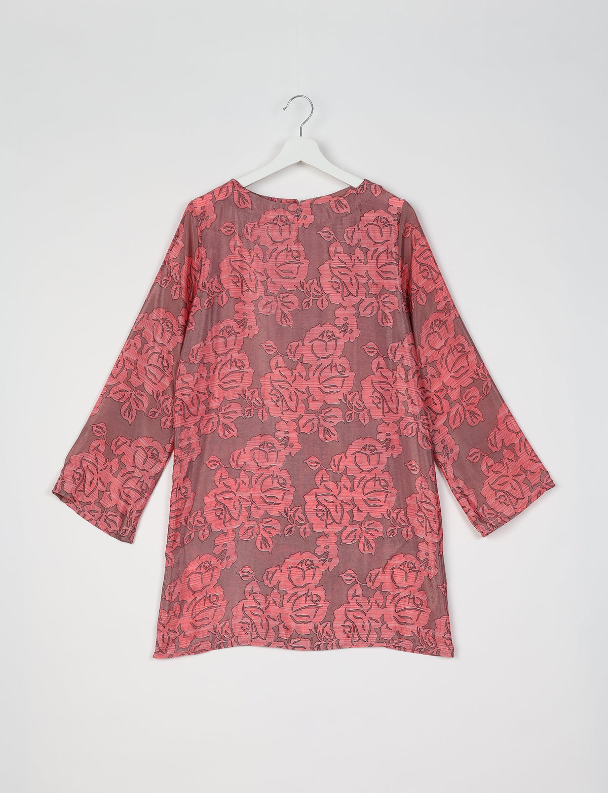 Grey swing dress with pink floral pattern, long sleeves, round neckline, shown from back on white hanger