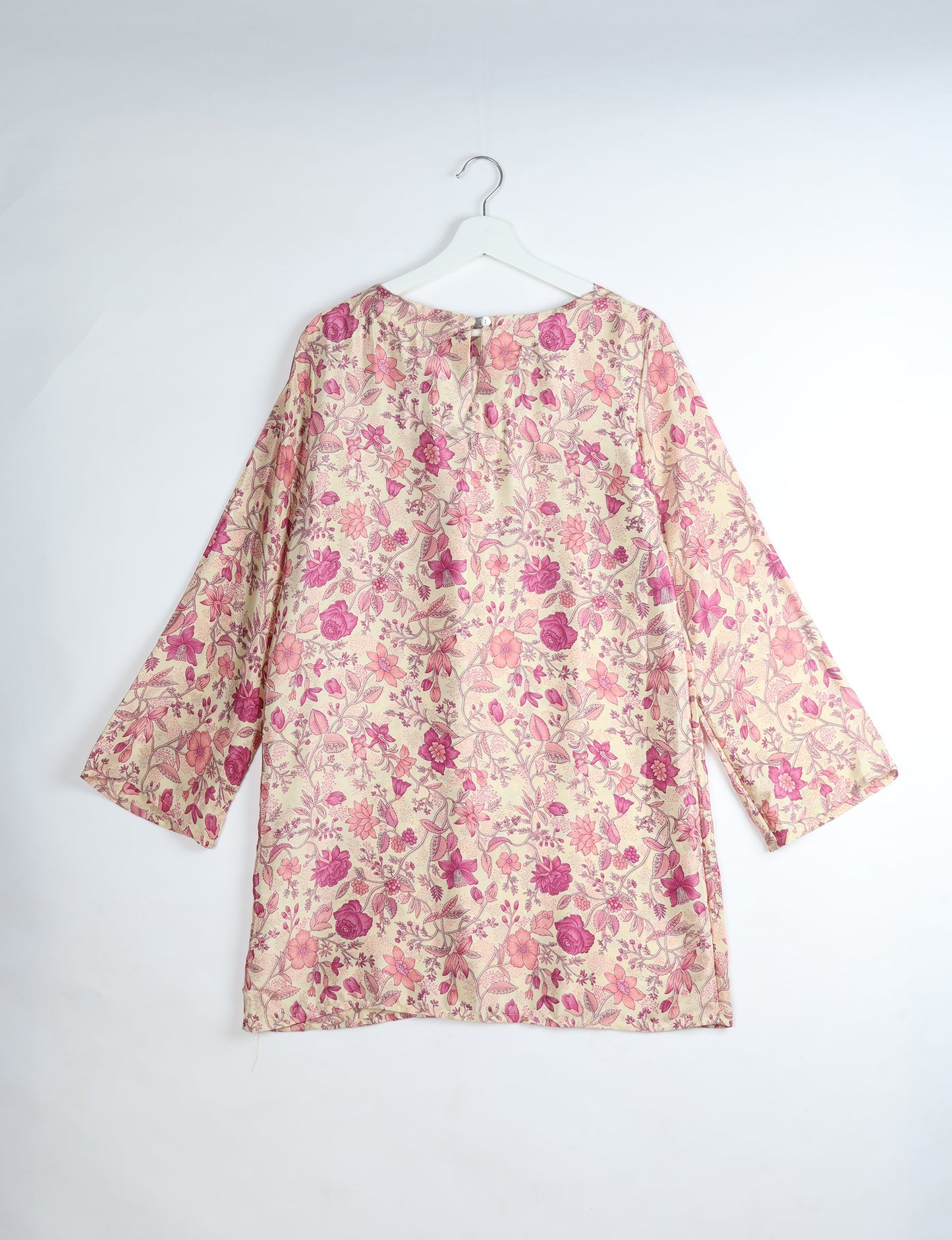 Chic and conscious, our A-line mini swing dress is a must-have in sustainable fashion. Adorned with flared sleeves, a keyhole back opening, and a mother of pearl button with twill tape loop. This zero waste, upcycled garment reflects the essence of eco-friendly and ethical clothing.