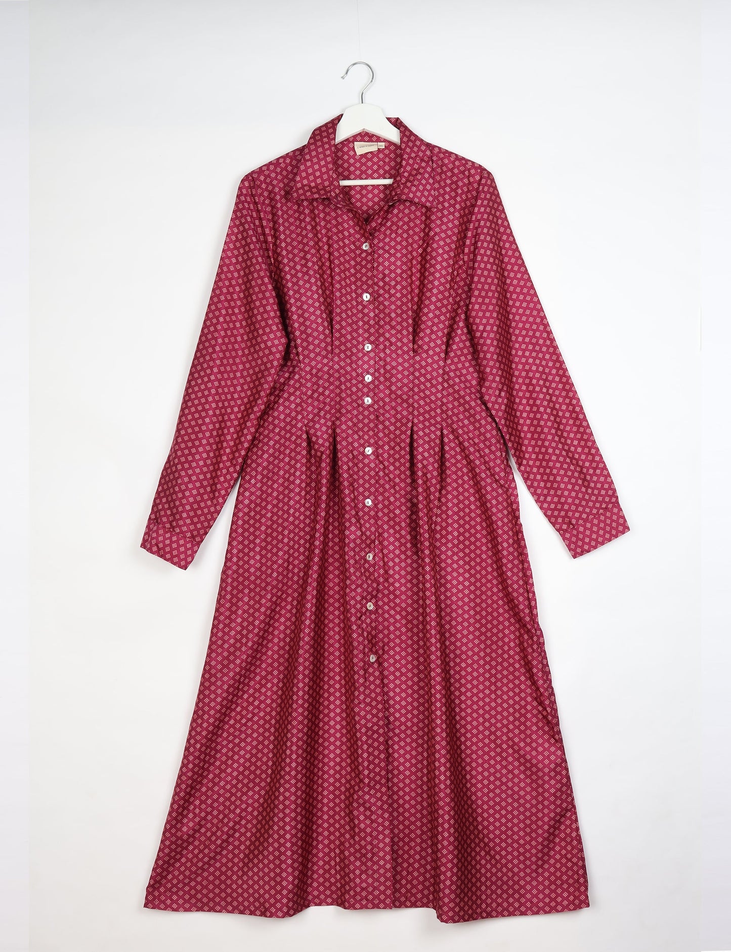 Midi shirt dress with cinched waist, crafted from recycled fabric. A sustainable women's clothing piece representing ethical fashion, eco-friendly products, and upcycled women's clothing.