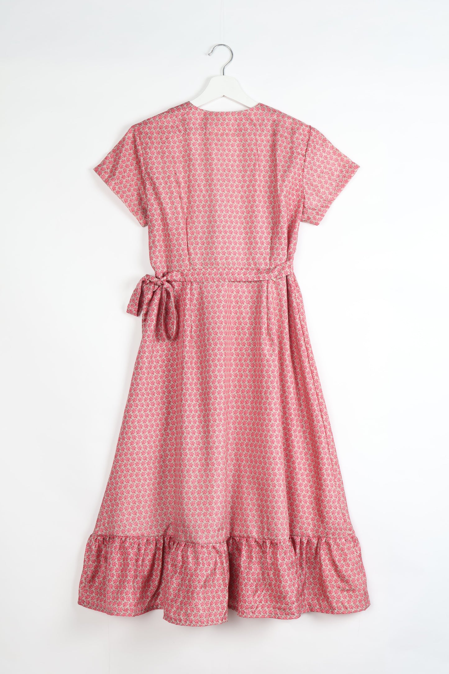 Embrace timeless elegance with our MIDI WRAP DRESS – a midi-length beauty featuring a v-neck, flattery from all angles, and a charming sari belt. Crafted from sustainable materials, this dress embodies ethical clothing and green fashion. Sophisticated with a frill tier at the hem and short cap sleeves, this dress is perfect for any occasion. Tie up the beautifully crafted sari belt on the side for a versatile, stylish, and eco-friendly look.