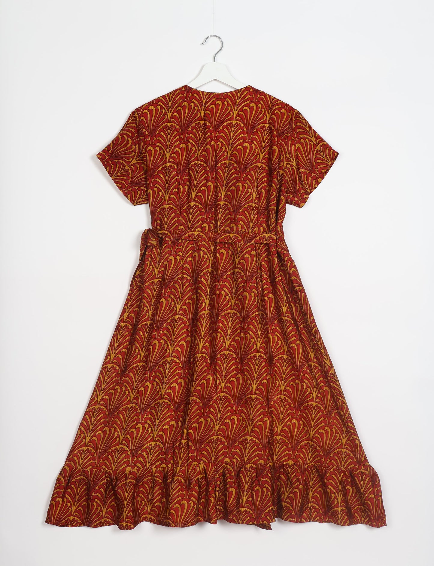 Embrace timeless elegance with our MIDI WRAP DRESS – a midi-length beauty featuring a v-neck, flattery from all angles, and a charming sari belt. Crafted from sustainable materials, this dress embodies ethical clothing and green fashion. Sophisticated with a frill tier at the hem and short cap sleeves, this dress is perfect for any occasion. Tie up the beautifully crafted sari belt on the side for a versatile, stylish, and eco-friendly look.